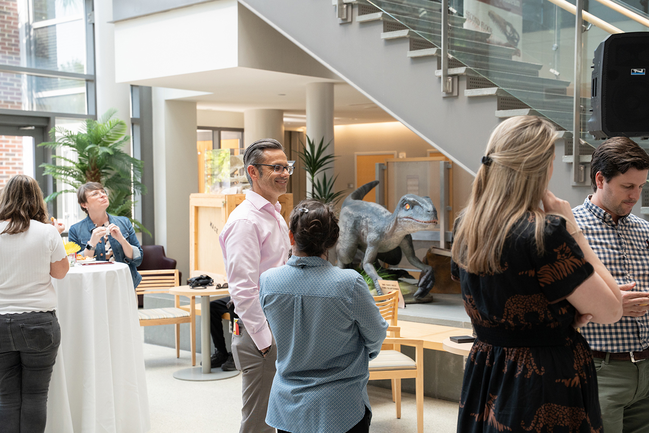 faculty mingle in lobby space
