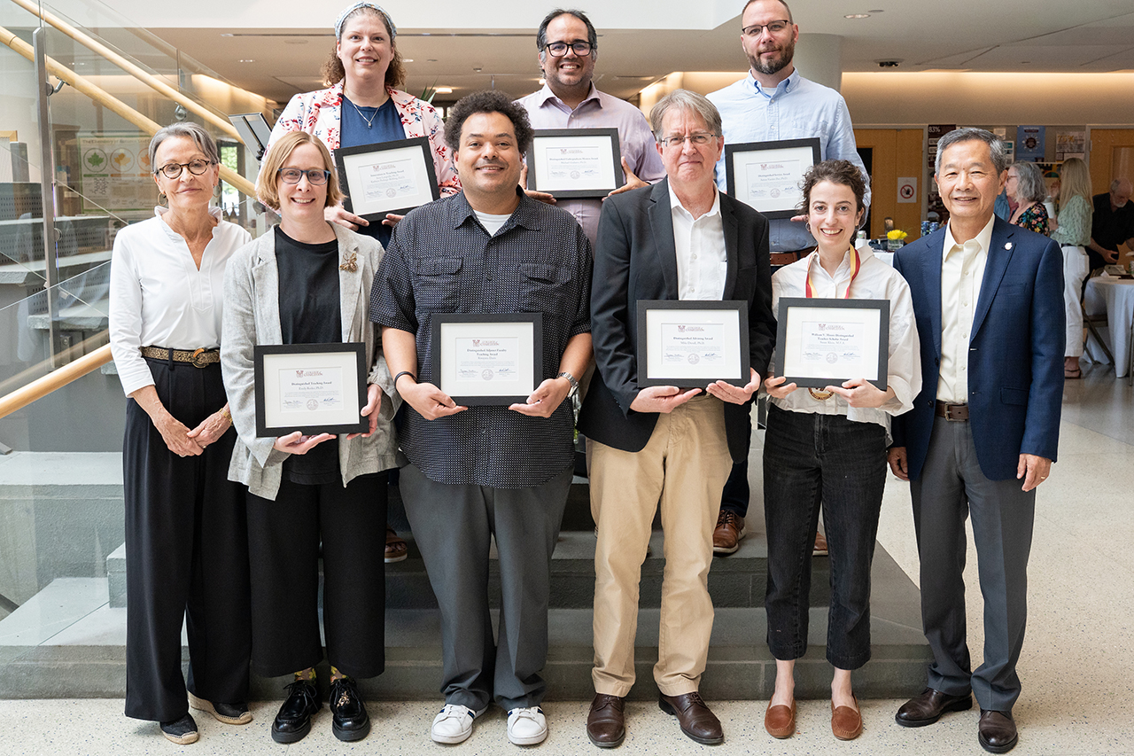 group shot of award winners holding their certificates