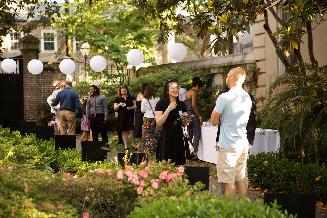 gathering in the Blacklock House courtyard