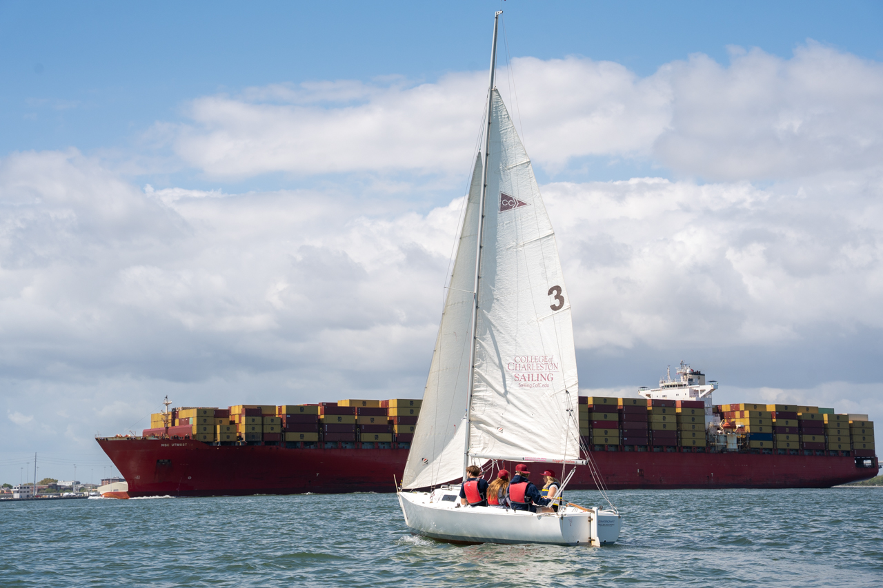 sailboat infant of container ship