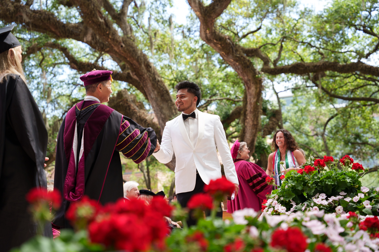 graduating and shaking hands
