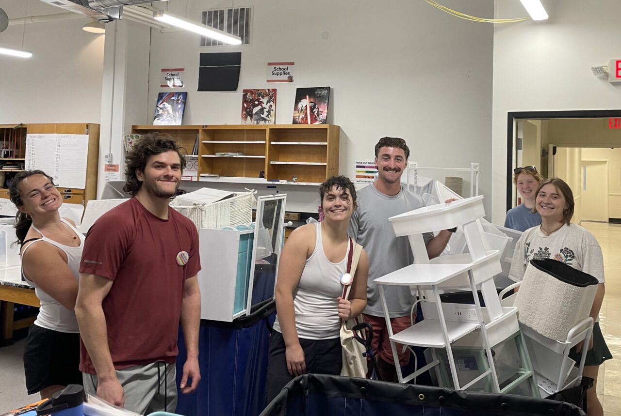 student volenteers sort good left over from move out