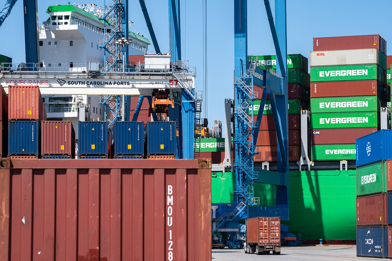 Image of containers and truck at port 