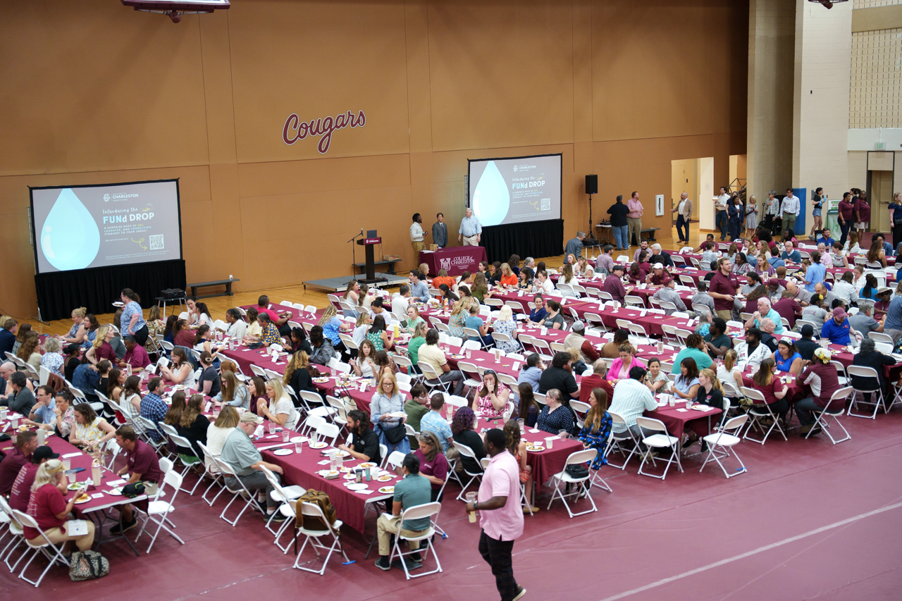 Overlooking people at awards function in gym