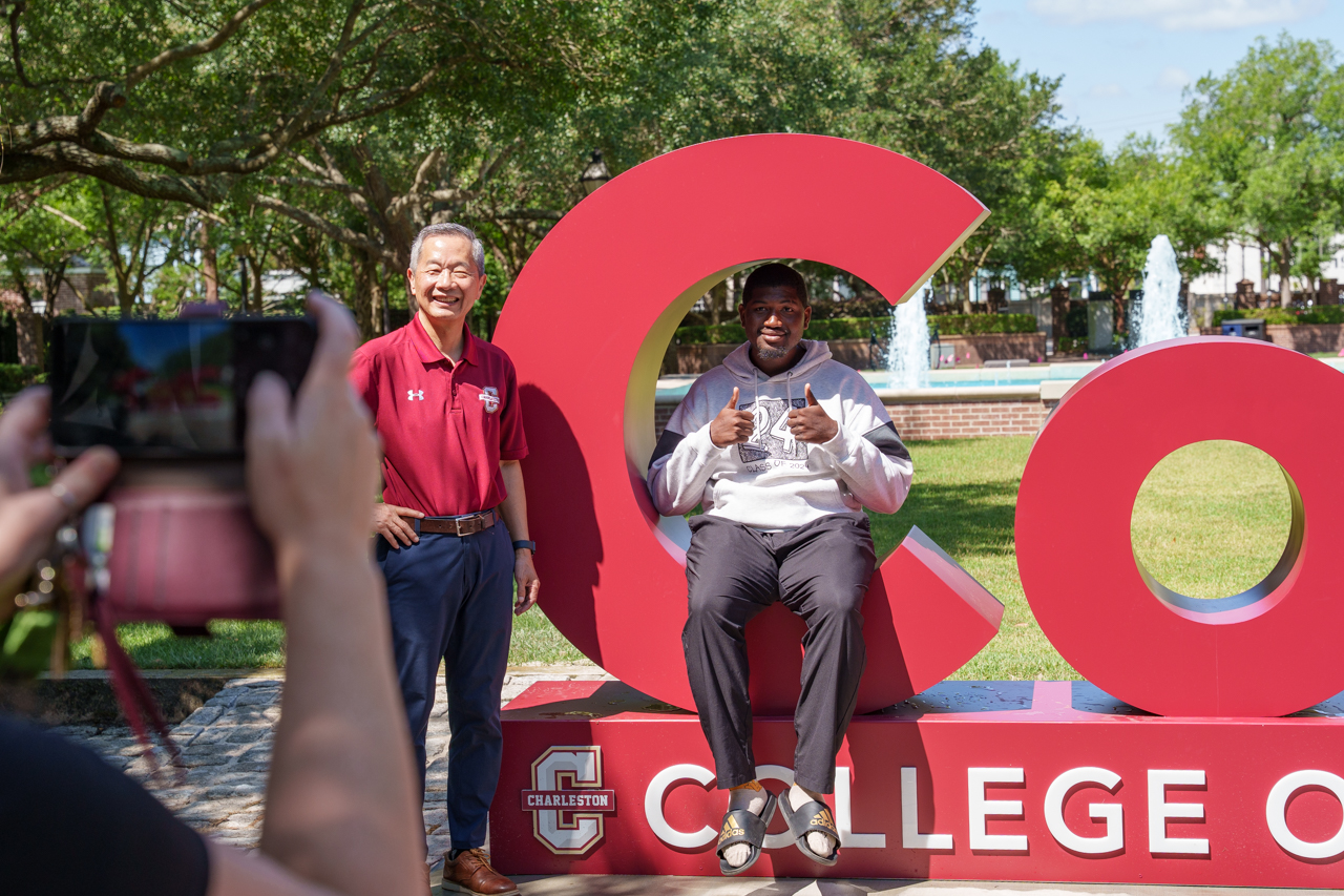 taking photos with the new CofC sign