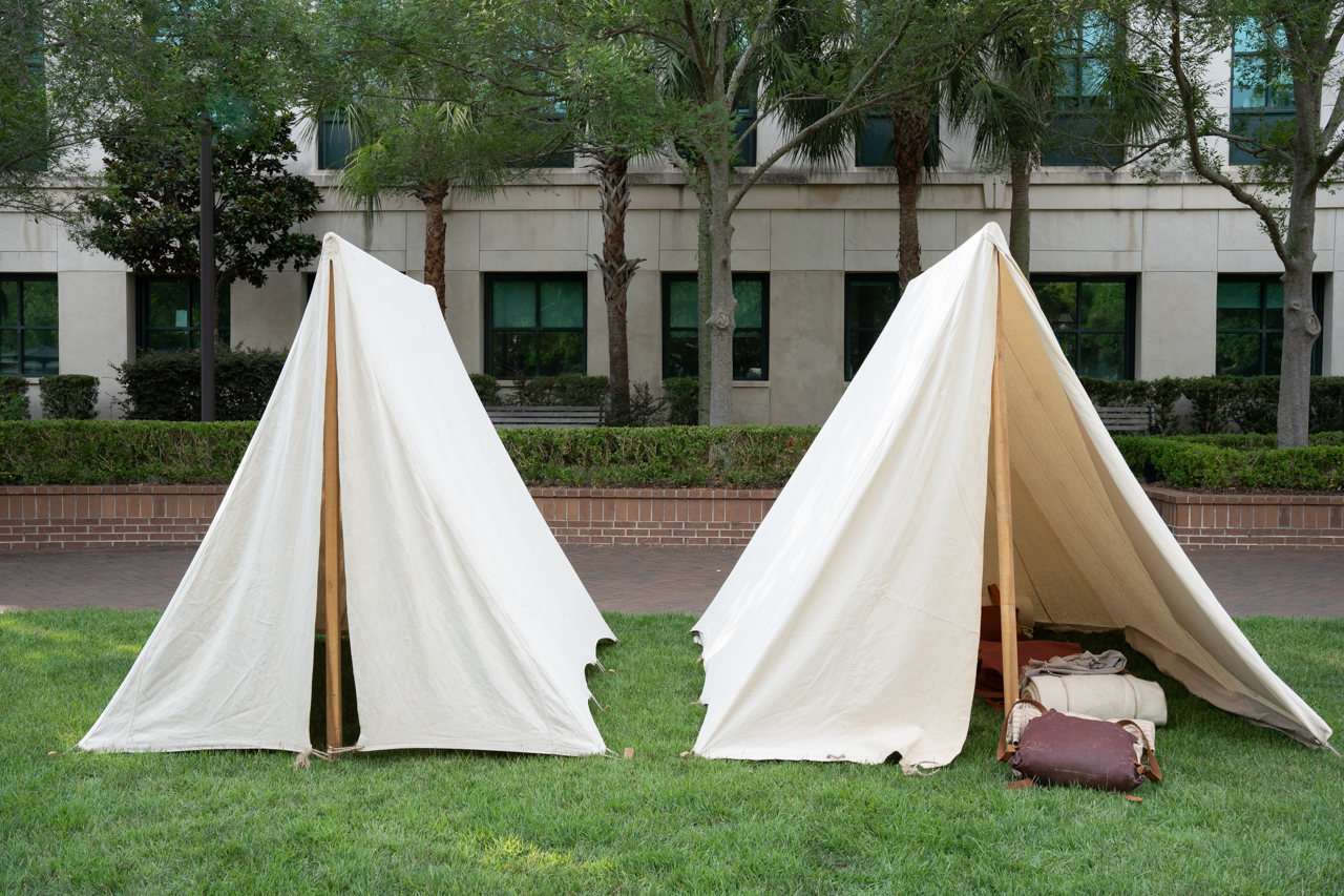 Smaller historical replica tents set up on rivers green