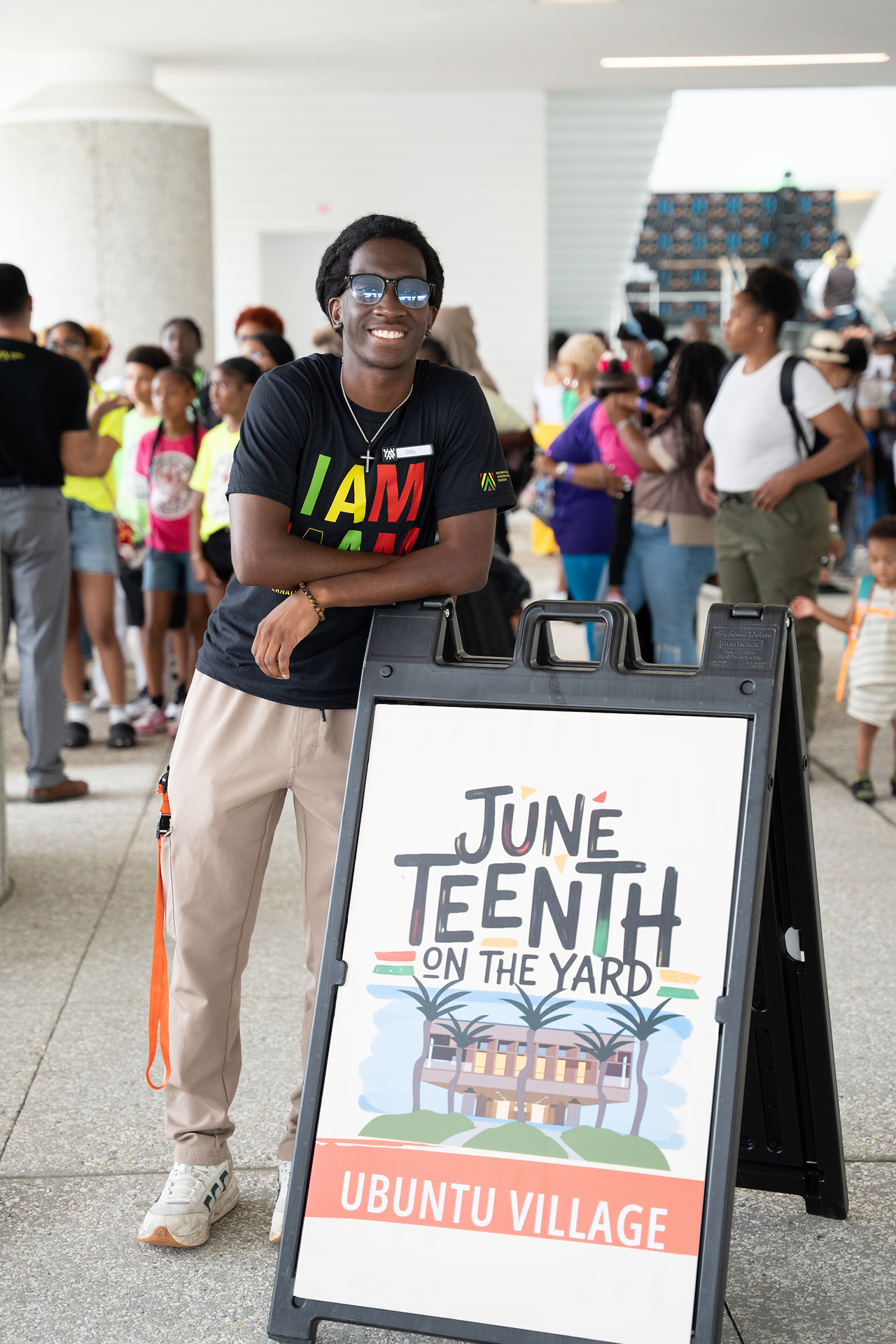 Otis Franklin posing with sign at IAAM