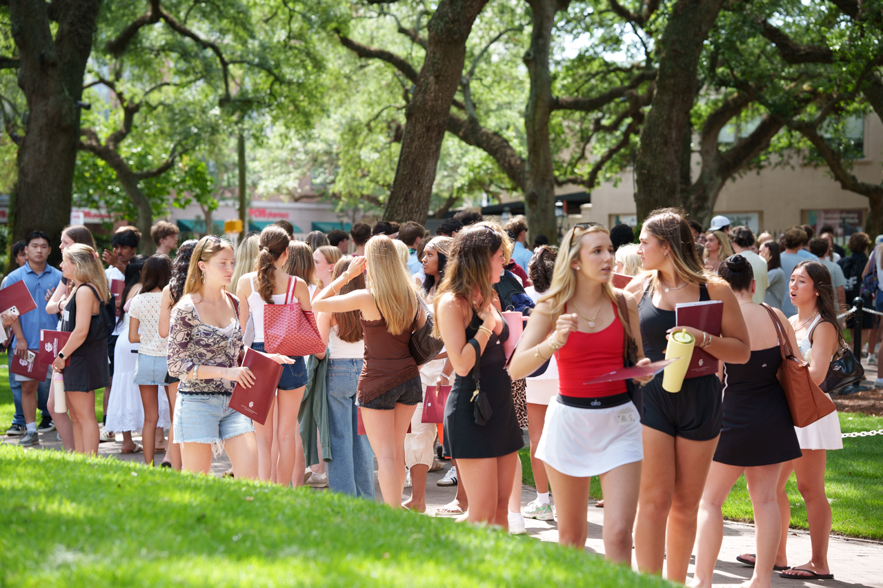 female students walk together in Cistern