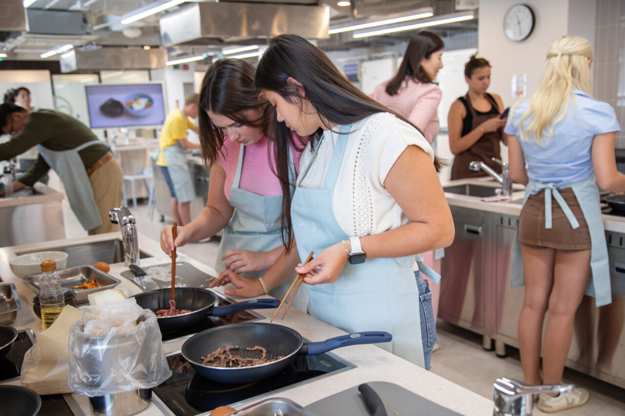 Two women cooking together