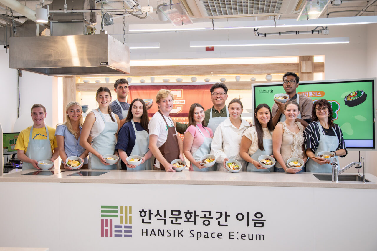 group photo of students participating in cooking class