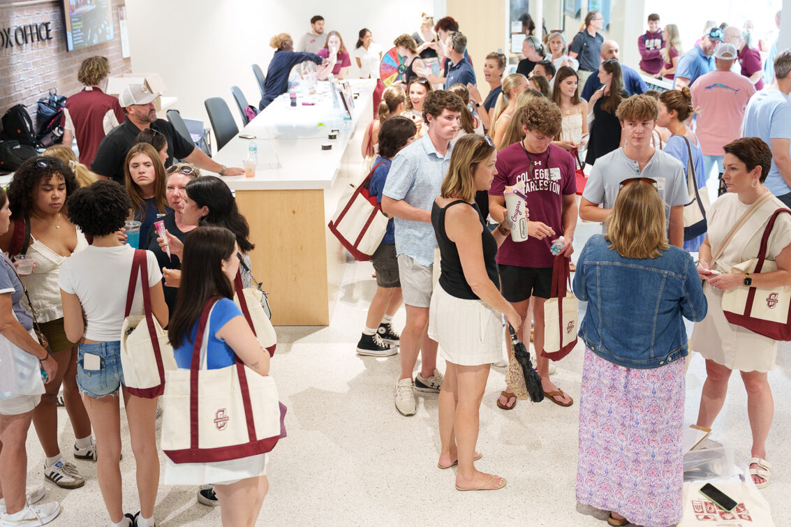 overview of new student orientation fair in the Simmons Center Lobby showing lots of students and parents