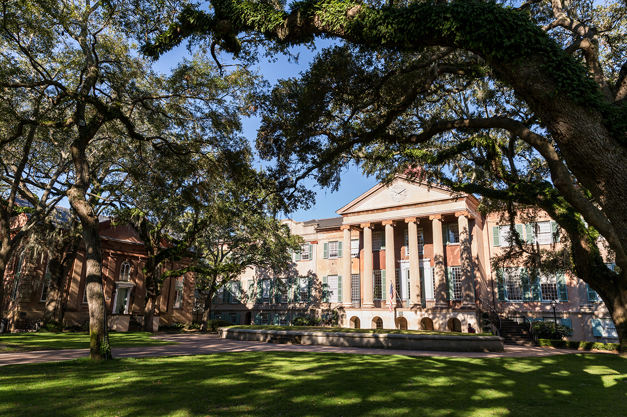 image of randolph hall from afar underneath the oaks