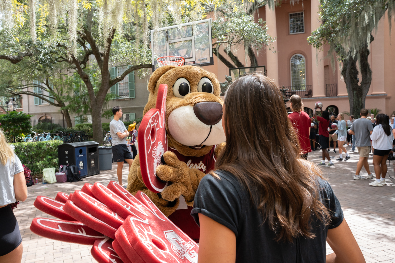 Clyde holds up college of Charleston hype sign