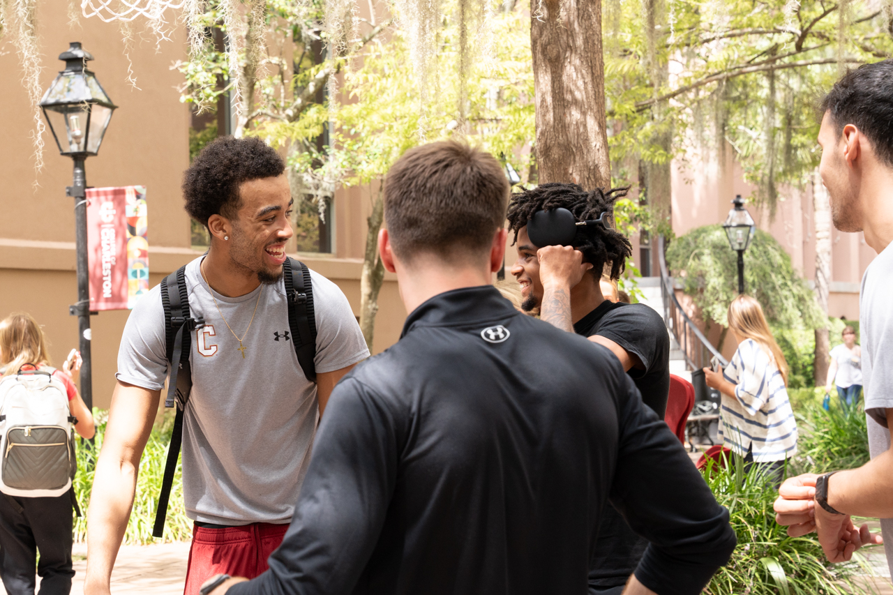 male basketball team members laugh together