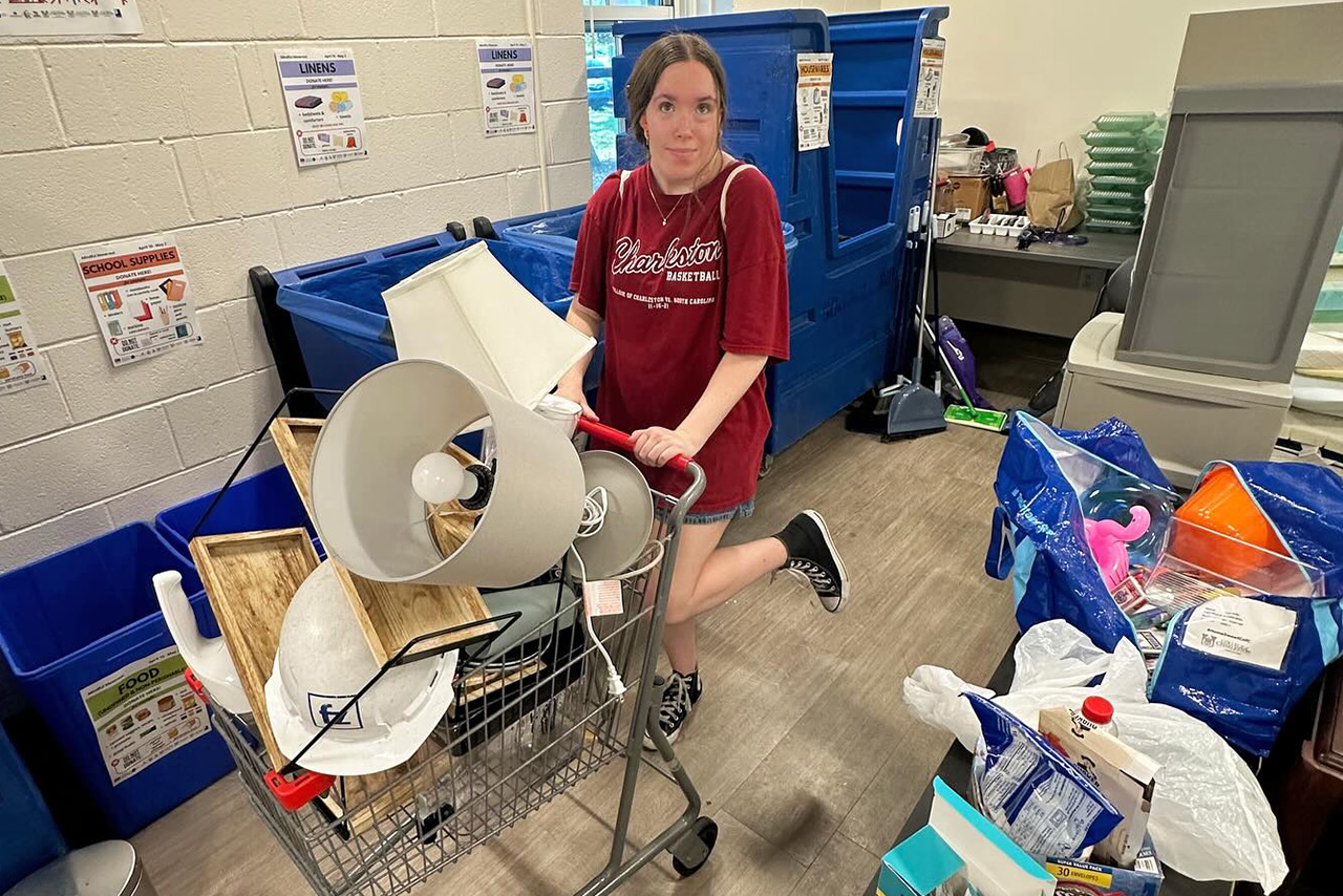 girl with a grocery cart of lamps